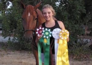 MULTIPLE WINS - Monika Qualls and her horse, Sunny, show off the ribbons they won at the State 4-H Horse Show. Submitted photo