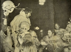 DISTRICT CHAMPIONS - Cartwright is hoisted up by players after winning the district title 7-0 against Windthorst in 1980. It was the 'Jackets first time in 10 years to win district. Messenger file photo by Ken Roselle