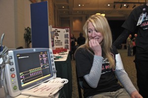 A CASE OF THE JITTERS - Christy Raasch, director of Wise Regional Health Foundation, bites her nails in anticipation of a blood pressure check at Tuesday's Heart Health Expo. The Expo was at Decatur Civic Center, and visitors were able to participate in various screenings, hear presentations on heart healthy living and learn about cardiac services at Wise Regional Health System. Messenger photo by Joe Duty