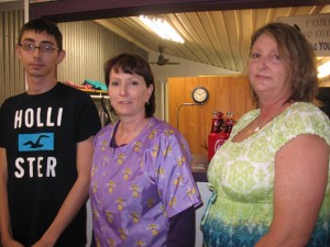 OPEN FOR BUSINESS - The Bridgeport Chamber of Commerce held a ribbon cutting for A-1 Discount Dog Grooming March 5. On hand for the celebration were (from left) Jordan Gibson, Karen Jones and Carolyn Meador.