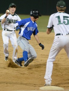 ESCAPING TRAP - Krum's Brandon Ellis tries to avoid tag of Paradise's Jarrett Holt. Ellis eventually stole second on the play in Krum's 11-1 win. Messenger photo by Mack Thweatt