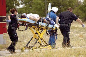LOADING UP - An unidentified employee of Heil Trailers in Rhome is moved from an ambulance to a waiting helicopter Friday after receiving an electrical shock. Messenger photo by Joe Duty