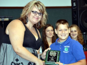 BRONZE AWARD - Clint Demmitt of Chico 4-H receives the Bronze Award from 4-H Program Assistant Andrea Calabretta. Ray Edwards of Paradise 4-H was also awarded the Bronze Award, but he was not present.