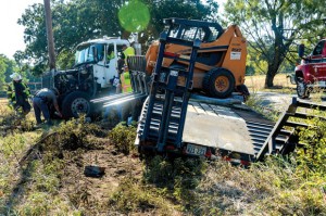 FATAL CRASH - Robert J. Penny, 41, of Pantego, was killed instantly after he ran his 18-wheeler off a road and struck a power pole Thursday morning on County Road 4599. Messenger photo by Joe Duty