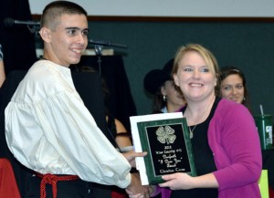 HARD WORK REWARDED - Christian Cross of Boyd 4-H receives the Danforth I Dare You Award from 4-H Agent Chrissy Karrer.