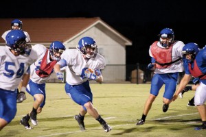 THROUGH THE HOLE - Damien Loving slips through the line on his way to the end zone, but his trip down the field was cut short by the defense. Messenger photo by Jimmy Alford