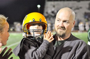 BOYD FANS - Gabrial Latham and his father, Ryan, attend as many Boyd football games as they can between Ryan's work and school schedule and Gabrial's chemotherapy schedule. Messenger photo by Kelly Guess