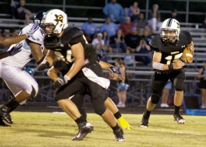 COMING AROUND - Chico's Dustin Hardee heads for open ground during the Dragons' win over the Eagles. Messenger photo by Jimmy Alford