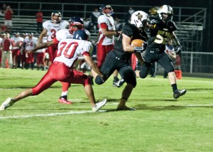 CROSSING THE LINE - Chico's Dylan Hightower carries into the end zone for a Dragon touchdown against Dallas Academy. Chico put 64 points on the board in the first half. Messenger photo by Jimmy Alford