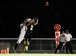 CUTTING IN - Dragon Matt Carter leaps in front of a TLCA player to intercept a pass Friday night. Chico went on to defeat the Eagles 43-6. Messenger photo by Jimmy Alford