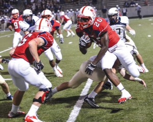 GO AROUND - Northwest's Emmanual Moore breaks a tackle against Keller. Messenger photo by Joe Duty