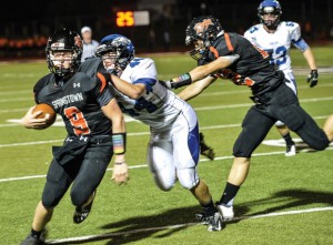 GOING DOWN - Decatur's Ethan Currin pulls down Springtown quarterback Colby moore. Messenger photo by Joe Duty