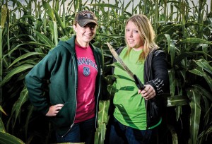HACKING AWAY - Brittany Smith (left) and Kriston Wilson carved out this year's Get Lost Maze. Wilson's family has been making the mazes for eight years now. She uses a machete to clear paths. Messenger photo by Joe Duty