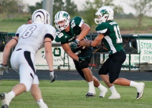 HANDING OFF - Panther Quarterback Tanner Valentine give the pigskin to running back Jarrett Roper early in Paradise's loss to Grandview. Messenger photo by Jimmy Alford