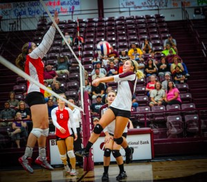 MID-AIR - Bridgeport's Tiffany Hawkins get the ball back over the net in the Sissies game with Mineral Wells Tuesday. Messenger photo by Joe Duty