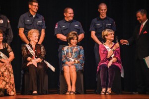 PAGEANT QUESTION - Peggy Goodwin answers a question from master of ceremonies Jay Craddock during the Ms. Senior Wise pageant as other contestants (front, from left) Nellie Redwine, Marguarette Roberts, Mary Helen Casillas and their escorts (back, from left) Decatur firefighters Rick King, Joe Boyd and Ryan Davis look on. The pageant gave local retailers a chance to exhibit their inventory in the Taste of Wise Look Local event. Messenger photo by Joe Duty