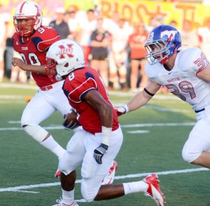 PICKED OFF - Reggie McDaniel begins to head upfield after an interception against Grapevine. Messenger photo by Mack Thweatt
