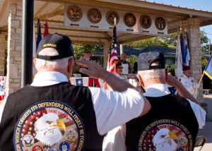 SALUTE - Veterans David Hodgson and Ruben Pinkerton stand at attention as the United States Flag and the Texas flag are presented during Decatur's 9/11 memorial ceremony. Messenger photo by Jimmy Alford