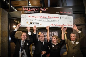 SCHOLARSHIP MONEY - Associate Dean Matt Joiner (from left), Vice President of Institutional Advancement and Executive Director of the Weatherford College Foundation Brent Baker, Event Chair Marianne Henderson and Dean Duane Durrett hold a check representing the donations made at Saturday night's Red Carpet Gala.