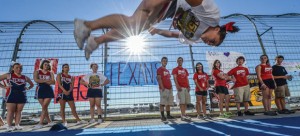 SCHOOL SPIRIT - Northwest High School junior Mallory Goodman performs a tumbling routine prior to the start of Tuesday's 9/11 ceremony at Texas Motor Speedway. Messenger photo by Joe Duty