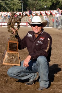 SOLID FINISH - The ever-consistent Trevor Brazile clutches the all-around trophy after winning in Pendleton. Photo courtesy of East Oregonian