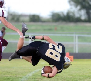 TAKING A TUMBLE - Alvord running back Brandon Aeling gets tripped up by a Millsap defender as he flies into the end zone head over heals. Messenger photo by Mack Thweatt