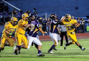 TO THE EDGE - Boyd's Fino Cardona gets around the Sanger defense during the Yellowjackets' win last Friday. Messenger photo by Joe Duty