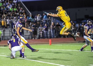 UP AND AWAY - Decatur's Chase Graham gets some air while attempting to block a sanger kick. Messenger photo by Joe Duty