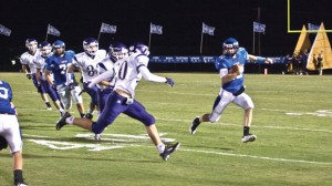 AROUND THE CORNER - Decatur's Grayson Muehlstein tries to get to the corner against Alvarado Friday.