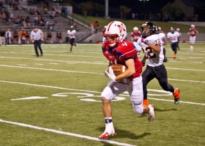 CATCH AND RUN - Northwest's Chase Morrison finds open space after making a catch against Haltom and scores the Texans' second touchdown and putting the team in the lead. Messenger photo by Jimmy Alford