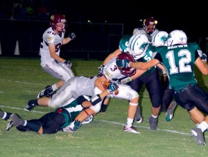 GANGING UP - Paradise's Jordan Carter and Hayden Brown make the stop against Whitesboro. Messenger photo by Mack Thweatt