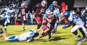 GIVING THE SLIP - Bridgeport's Hunter Gantt is surrounded by Eagle defenders as he makes his way down the field. Messenger photo by Joe Duty