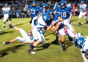 HAD HIT - Decatur's Jared Durdon is brought down on a punt return. Messenger photo by Joe Duty