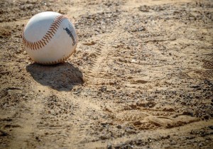LASTING IMPRESSION - Wheelchair tracks leave their mark on a baseball field at Kenny Renshaw Park in Decatur, where Wise County Special Needs Baseball league hosts its games every Saturday beginning at 9 a.m. Although suitable, a dirt field is not ideal for wheelchair-bound participants and their buddies who push them around the field. Like the tire tracks, volunteers such as the Jones family of Rhome leave their mark on the players they interact with through the league. Messenger photo by Joe Duty