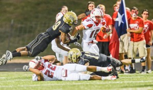 MAKING HIS MOVE - Northwest's Dylan Stubbe makes his way downfield during the Texans' 31-10 victory over Fossil Ridge Thursday. Stubbe scored two second half touchdowns. Messenger photo by Joe Duty