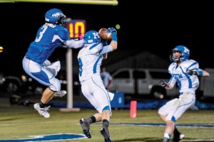 NICE CATCH - Krum's Angel Martinez Hauls in a touchdown pass against Ben Blattner. Messenger photo by Joe Duty
