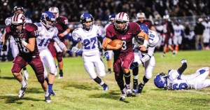 OPEN LANE - Gabe Huerta (3) gets a lead block from Alex Kline during the Bulls win over Decatur Friday. Messenger photo by Joe Duty