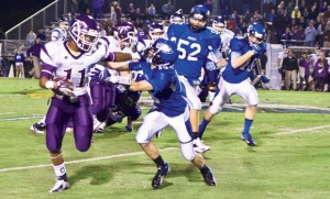 OUT OF REACH - Decatur's Austin Givens lunges to make the tackle against Alvarado's Marcus McNeil. Messenger photo by Jimmy Alford