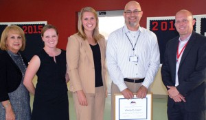 OUTSTANDING TEACHER - Northwest High School government teacher Charles Cooper (second from right) was presented a plaque and $5,000 cash award for receiving the 2012 Outstanding Teaching of Humanities Award. Pictured (left to right) are Joy Ann Havran, Humanities Texas board member; Liz James, coordinator of educational programs at Humanities Texas; Chandler Cochran, field representative for Sen. Jane Nelson; Cooper; and Jason Childress, NHS principal. Submitted photo