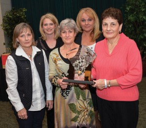 REMEMBERING ROY - Roy Young's sisters (from left) Debra Walker of Decatur, Linda Young of Fort Worth and Barbara Ashcraft of Waco accept the 2012 Citizen of the Year award on behalf of his family at Saturday's Decatur Chamber of Commerce banquet. Chamber Executive Director Misty Hudson and President Lisa Caraway (back) helped present the award. Messenger photo by Joe Duty
