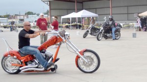ROLL ON - A rider braves the weather for the first-ever Justin Hunger Run. Messenger photo by Mary Wendell