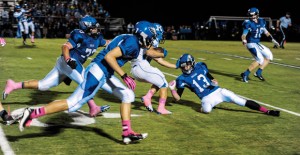 RUNDOWN - Decatur's Kevin Lindsay (72) and Austin Givens (13) chase down a Krum runner Friday. The Bobcats won 45-34. Messenger photo by Joe Duty