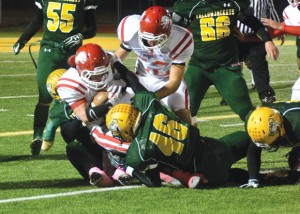 TAKEDOWN - Chase Graham and a host of Yellowjackets tackle a Ponder runner. Messenger photo by Mack Thweatt