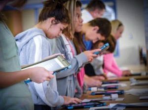 TAKING THE SURVEY - The first thing students did with their iPads was take a technology survey. Over the next few days, students will receive their iPads for use in the classroom and at home. Messenger photo by Joe Duty