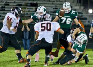 UP IN THE AIR - Paradise quarterback Tanner Valentine loses the ball as he is sacked in the second quarter, handing Pilot Point the possession. Messenger photo by Jimmy Alford