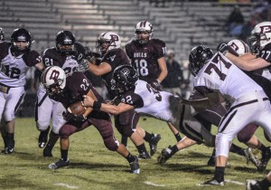 UP-THE-MIDDLE - Bridgeport's Michael Rivera breaks a tackle Friday against Princeton. Messenger photo by Joe Duty