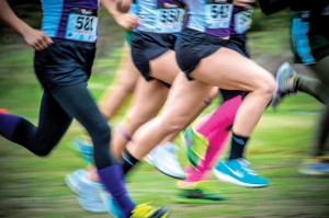 WHEN COLORS RUN - Cross country runners move along the trail in their brightly colored socks and shoes on a brisk Saturday morning at the Decatur Reunion Run. Messenger photo by Joe Duty