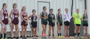 WINNING SMILES - Team members from Millsap, Paradise and Alvord receive their medals after the district cross-country meet Monday. Messenger photo by Mack Thweatt