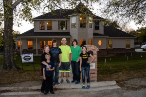 A PLACE TO CALL HOME - Laura Blaylock (second from left) and her five children - Cason, Lane, Brevon, Christian and Miranda - moved into their new home last week. Messenger photo by Joe Duty