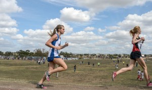 AGAINST THE WIND - Decatur's Nicole Neighbors runs in the windy conditions Saturday at the state meet in Round Rock. Messenger photo by Joe Duty